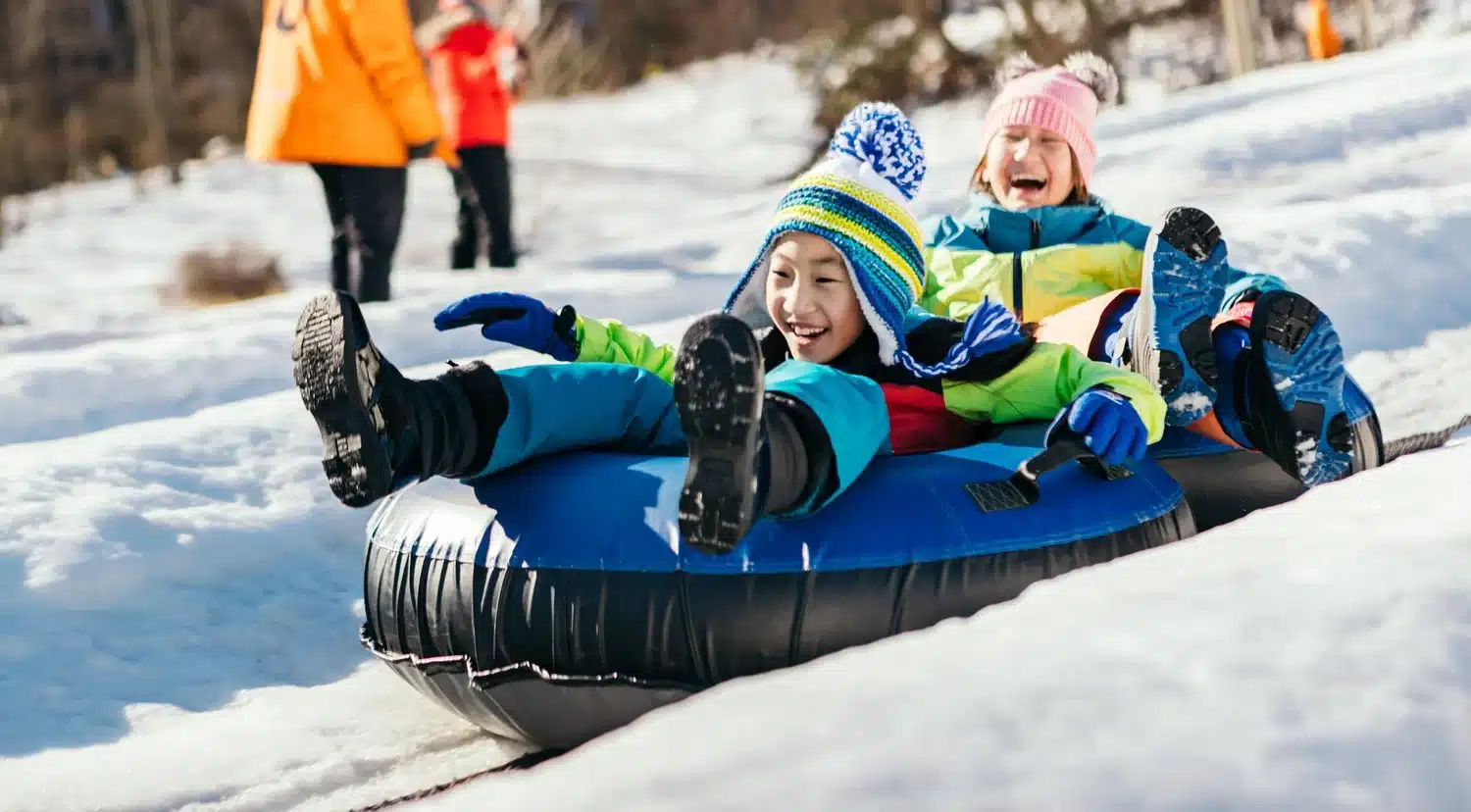 imgi 137 winter happenings kids sledding on snow tube at camelback resort 8e1c20